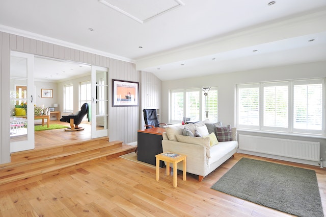 a double living room with hardwood floors