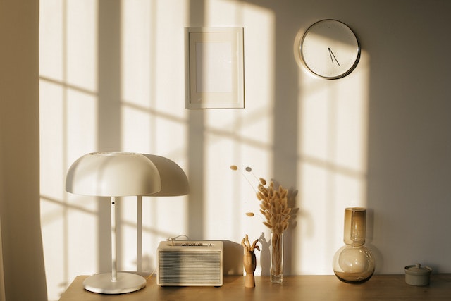 a shelf with beige accents being lit up by the sunshine