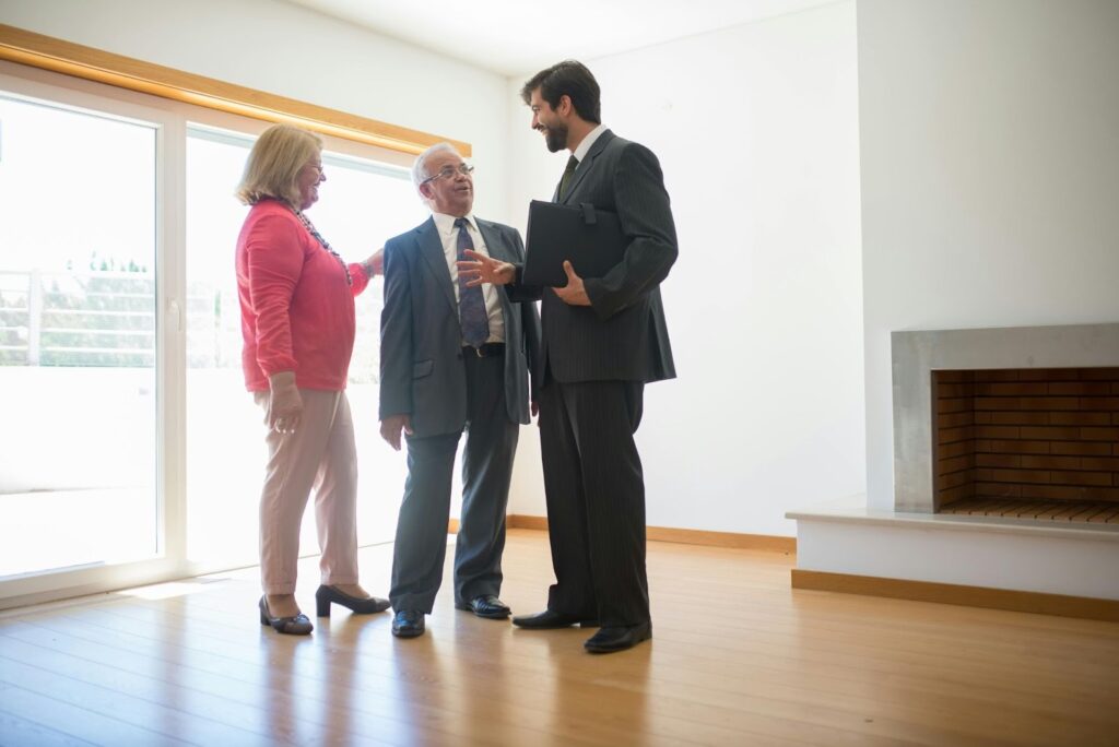 three people looking at a rental property