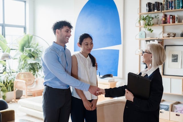Real estate agent talking with couple