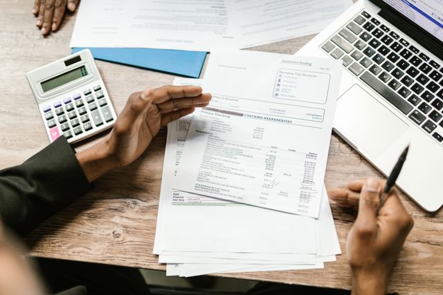 person reviewing documents at a desk