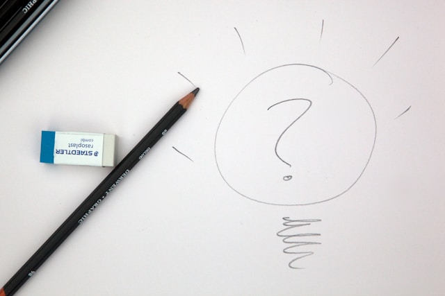 a question mark drawn on a piece of paper