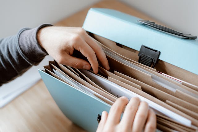 person looking through documents